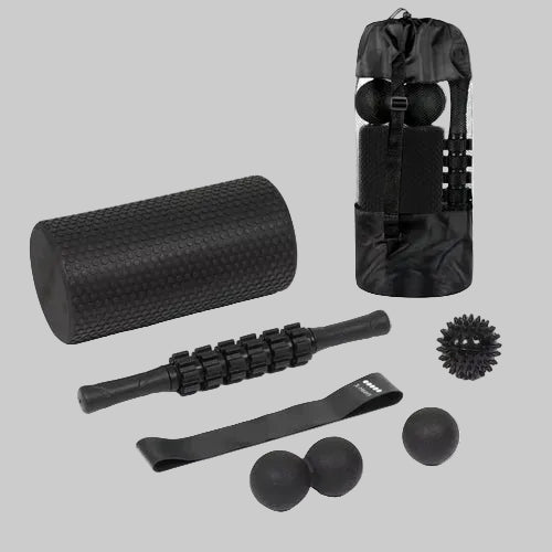 Collection of black massage and fitness tools including a foam roller, massage stick, balls, and a roller bag on a white background.